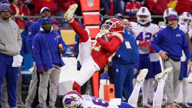 Dec 10, 2023; Kansas City, Missouri, USA; Kansas City Chiefs safety Chamarri Conner (27) intercepts a pass intended for Buffalo Bills tight end Dalton Kincaid (86) during the first half at GEHA Field at Arrowhead Stadium. Mandatory Credit: Denny Medley-USA TODAY Sports  